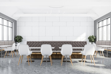 White and grey cafe interior with sofa