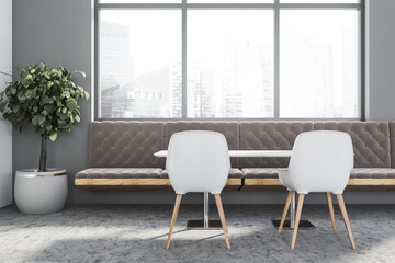 White and grey restaurant interior with sofa