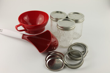 Canning supplies, mason jars, rings, lids, wide mouth funnel and large red ladle
