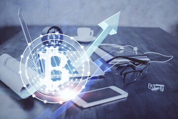 Double exposure of blockchain and crypto economy theme hologram and table with computer background....