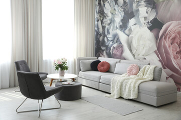 Modern living room interior with comfortable sofa and armchairs