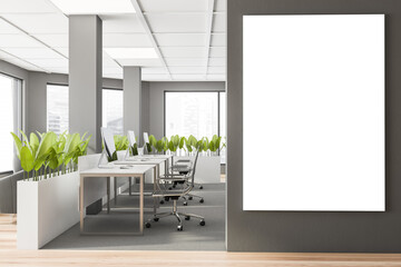 Grey open space office interior with poster