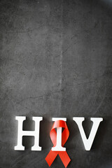 Symbol of human immunodeficiency virus disease. Red ribbon. A helping hand and support.