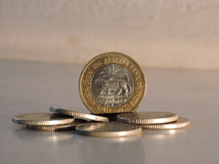 Golden coin in the front of the golden coins