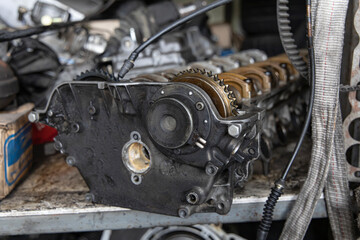 Close up old Cylinder head on the shelf at garage work shop.