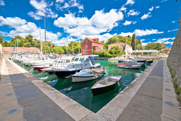 Fototapeta na wymiar Zadar. Historic Fosa harbor bay in Zadar boats and architecture colorful view
