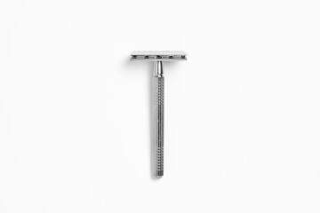 Vintage safety metal razor isolated on a white background. Shaving razor.High-resolution photo.