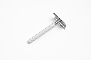 Vintage safety metal razor isolated on a white background. Shaving razor.High-resolution photo.