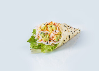 Japanese Temaki Hand Roll Sushi with crab meat (crab sticks), flying fish roe (Tobiko caviar), avocado, salad leaf, rice, sesame seeds in Mamenori seaweed. Close-up Pan Asian menu dish. Copy space.
