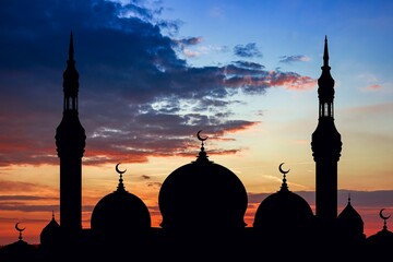 Mosque silhouette against sunset sky , religion background