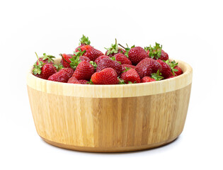 Strawberries in a wooden plate on a white background.Close-up.