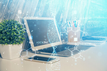 Desktop computer background and DNA drawing. Double exposure. Science concept.