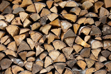 wooden firewood stacked in a huge pile. wood texture
