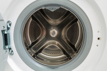 View of the open laundry loading compartment of the washing machine.