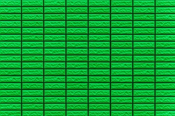 Modern pattern of green stone block wall tile texture and seamless background