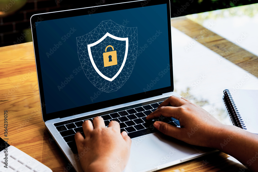 Poster person using a laptop computer with data protection, cyber security secure, information safety and e