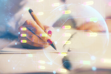 Multi exposure of woman's writing hand on background with data technology hologram. Concept of innovation.