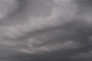 Fototapeta premium background photo of a dark gray sky similar to sea waves
