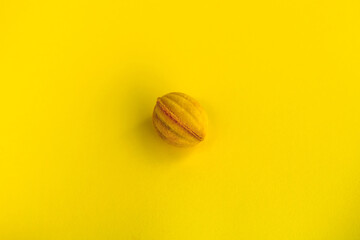 Top view of tasty yellow colored Eastern European cookie isolated on a bright yellow background. Sweet and colorful cookies with condensed milk . Dessert. Homemade sweets. Café dessert. Clipping path
