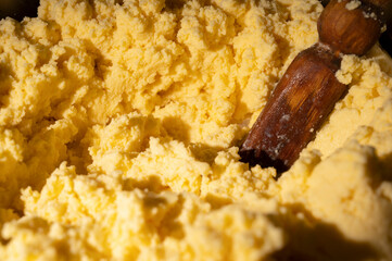 close-up photo of whipped country butter and a wooden stick