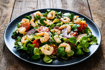 Prawn salad on wooden table
