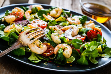 Prawn salad on wooden table
