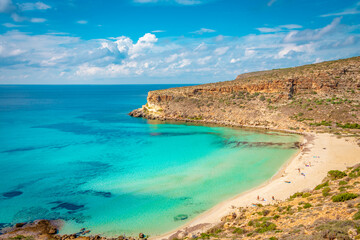 Crystal clear water at the pristine Rabbit’s beach (spiaggia dei conigli) in Lampedusa, Pelagie islands, Sicily - obrazy, fototapety, plakaty