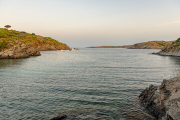 Spain Costa Brava peaceful pebble beach of the Mediterranean sea, Cala Guillola, Cadaques, Cap de Creus, Catalonia