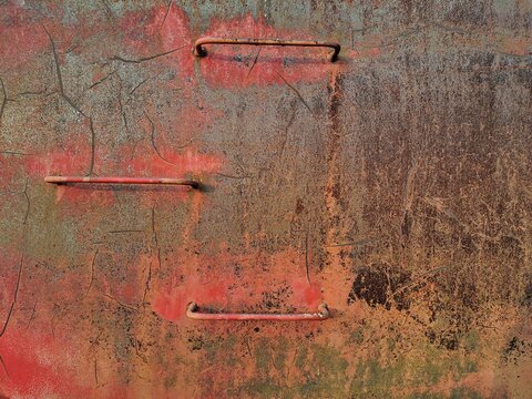 The rust that is attached to the metal tank is broken into beautiful traces.