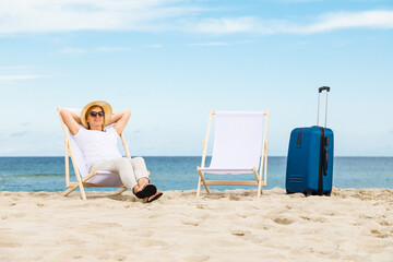 Woman relaxing on beach
