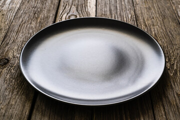 Empty plate on wooden table
