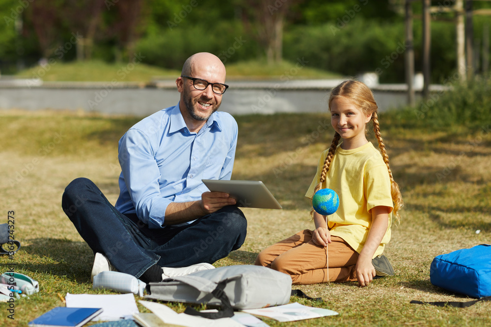 Canvas Prints full length portrait of smiling bald teacher looking at camera while enjoying outdoor astronomy less