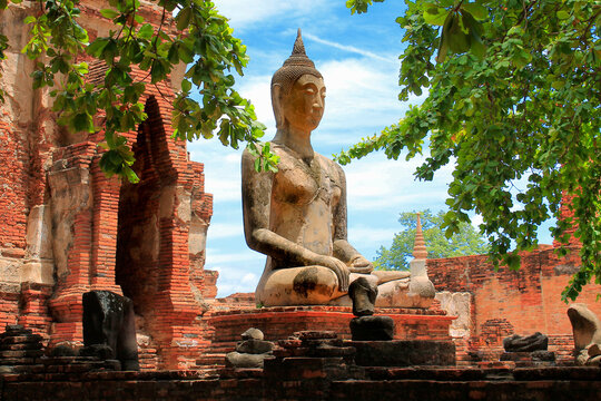 Old buddha image at wat mahathat ancient sites in ayutthaya province.