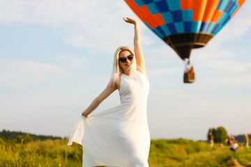 hot air balloon over the green paddy field. Composition of nature and blue sky background