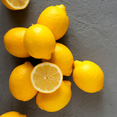 Fresh Ripe Yellow Organic Lemons on gray surface, overhead view. Flat lay, top view, from above....