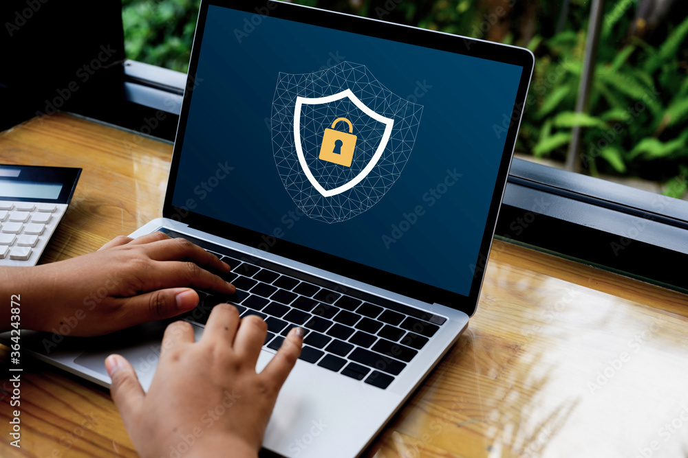 Poster person using a laptop computer with data protection, cyber security secure, information safety and e