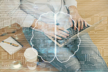 Businessman with computer background with brain theme hologram. Concept of brainstorm. Multi exposure.