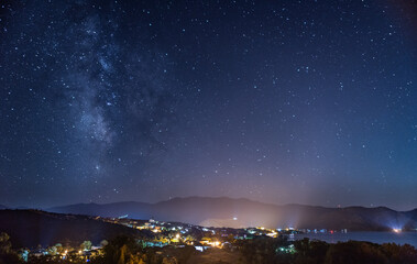 Starry night sky over the Gulf of Saint Florent, Corsica - obrazy, fototapety, plakaty