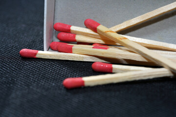 Lit matches and blown out in the studio photographed with colorful foils before the flashes