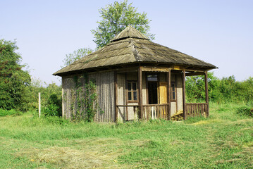 Cabin in the forest, a house located outside the city, view.