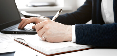 Cropped view of businessman works with financial papers at the table. Finance concept