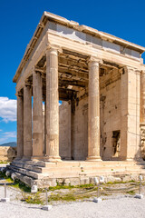 Obraz premium Panoramic view of Erechtheion or Erechtheum - temple of Athena and Poseidon - within ancient Athenian Acropolis complex atop Acropolis hill in Athens, Greece