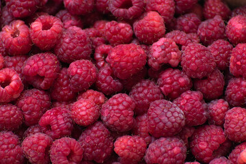 Beautiful background of a ripe large raspberries