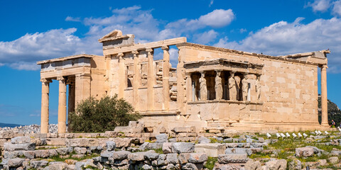 Obraz premium Panoramic view of Erechtheion or Erechtheum - temple of Athena and Poseidon - within ancient Athenian Acropolis complex atop Acropolis hill in Athens, Greece