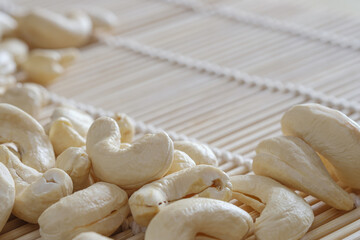 Raw Cashew nuts  on the wood floor bamboo,close up