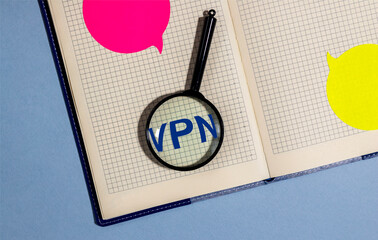 VPN Virtual Private Network word acronym on paper with magnifying searching glass