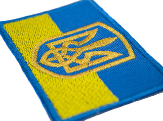 The embroidered patch. Attributes for soldiers and patriots. Patch with the emblem of Ukraine on the state flag of Ukraine. National symbols of the state of Ukraine. 