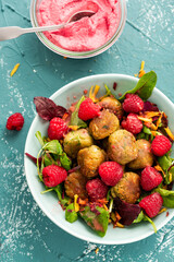 Healthy Falafel with Salad and Fresh Fruits in Colorful Bowl