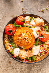 Stuffed Sweet Potato with Couscous and Vegetables in Bowl