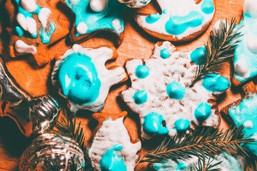 Fototapeta na wymiar Homemade delicious gingerbread with blue and white glaze. Baking with your own hands. Christmas background.